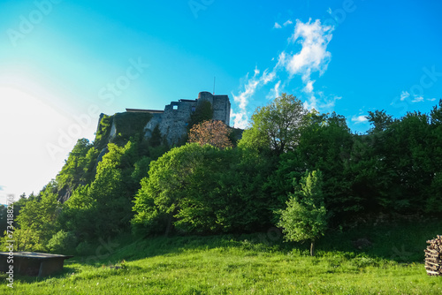 Scenic view of medieval Finkenstein Castle in Altfinkenstein, Carinthia, Austria. Tranquil atmosphere along hiking trail in spring. Steep cliff at southern foot of the Karawanks mountain range photo