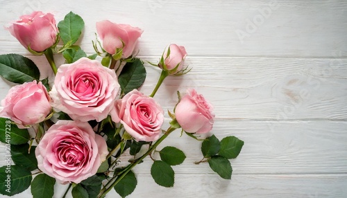 bouquet of pink flowers roses on a white background with space for text top view flat lay © Robert