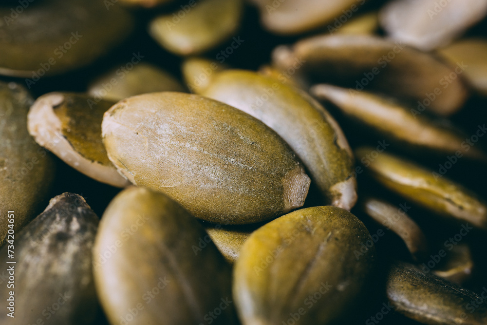 Hulled pumpkin seeds in a large pile. Pumpkin seeds Hulled pumpkin seeds in a large pile. Pumpkin seeds