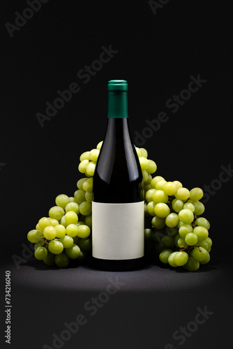 Wine bottle with grapes