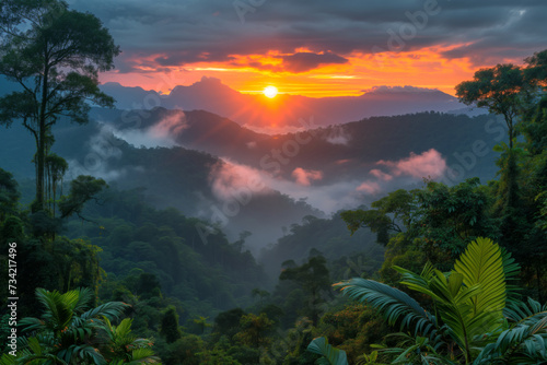 Sun setting over the jungle mountains nature wallpaper background © Spicy World