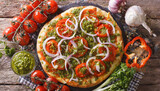 Italian pizza with tomatoes, pepper, onion 
