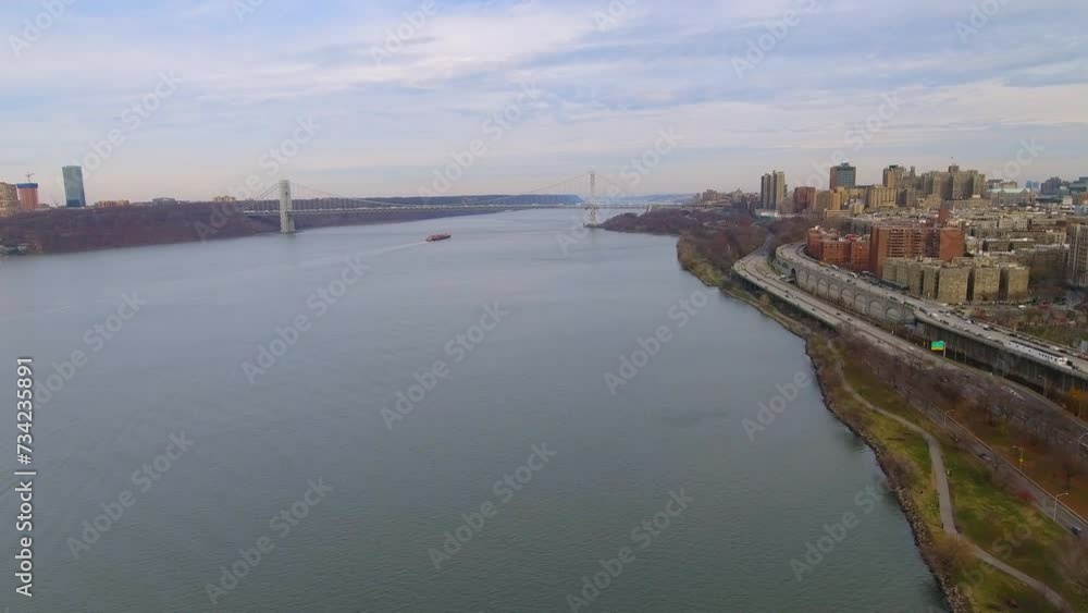 Aerial Shot Of Robert F. Kennedy Bridge In Residential City, Drone Flying Forward Over River - New York, New York Aerial Shot Of Robert F. Kennedy Bridge In Residential City, Drone Flying Forward Over River - New York, New York