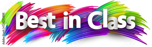 Best in class paper word sign with colorful spectrum paint brush strokes over white.