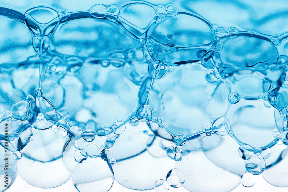 Close-up of bubbles in water, scientific background of cosmetic essence, serum under a microscope. Hydration The concept of developing cosmetics for skin care. Beauty Hydration background Close-up of bubbles in water, scientific background of cosmetic essence, serum under a microscope. Hydration The concept of developing cosmetics for skin care. Beauty Hydration background