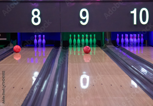 Bowling ball rolling down the alley toward the pins at 10 pin bowling alley © Sarah