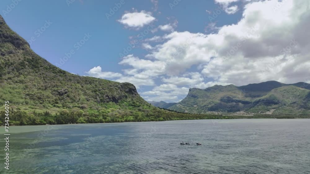 Horseback Riding In The Water In Mauritius, Aerial View Horseback Riding In The Water In Mauritius, Aerial View