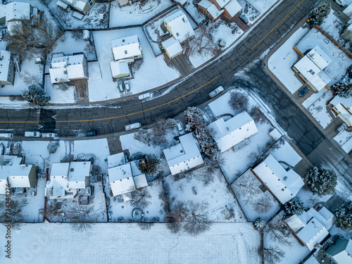 winter morning over a residential area of Fort Collins in northern Colorado with fresh snow, aerial view