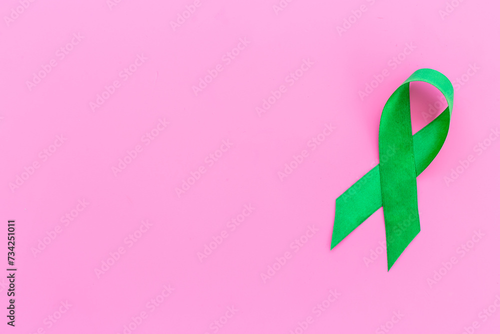 Green ribbon symbol of why cancer and mental health awareness concept Green ribbon symbol of why cancer and mental health awareness concept