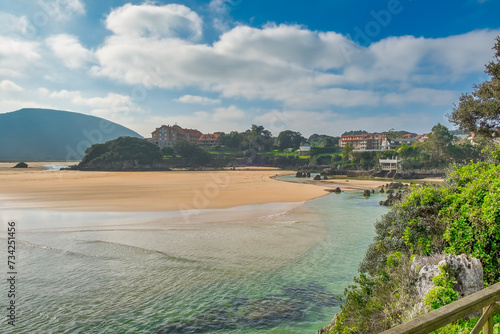 Beach in the tourist area in the town of Isla, Cantabria, Spain.