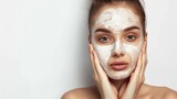 Purifying Facial Mask Treatment - Portrait of a young woman with a facial mask, touching her face gently, showcasing her skincare routine