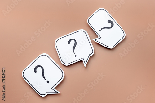 Question marks on paper speech bubbles. FAQ concept or search information concept