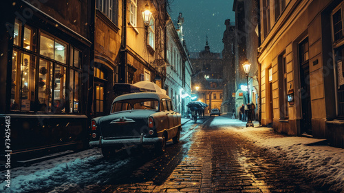 Vintage car park at old street in Prague city in a rainy night. © Joyce