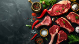 A selection of raw, high-quality steaks arranged artistically with fresh herbs, spices, and chili peppers on a dark background, ready for cooking.