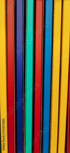 Books. A lot of books with bright covers in one pile. Design element, paper and leather texture. Colorful books on the shelf, close up