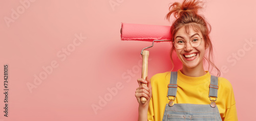 Young woman with painter roller, posing next to pink wall - empty copy space. Funny quirky face expression. Generative AI photo