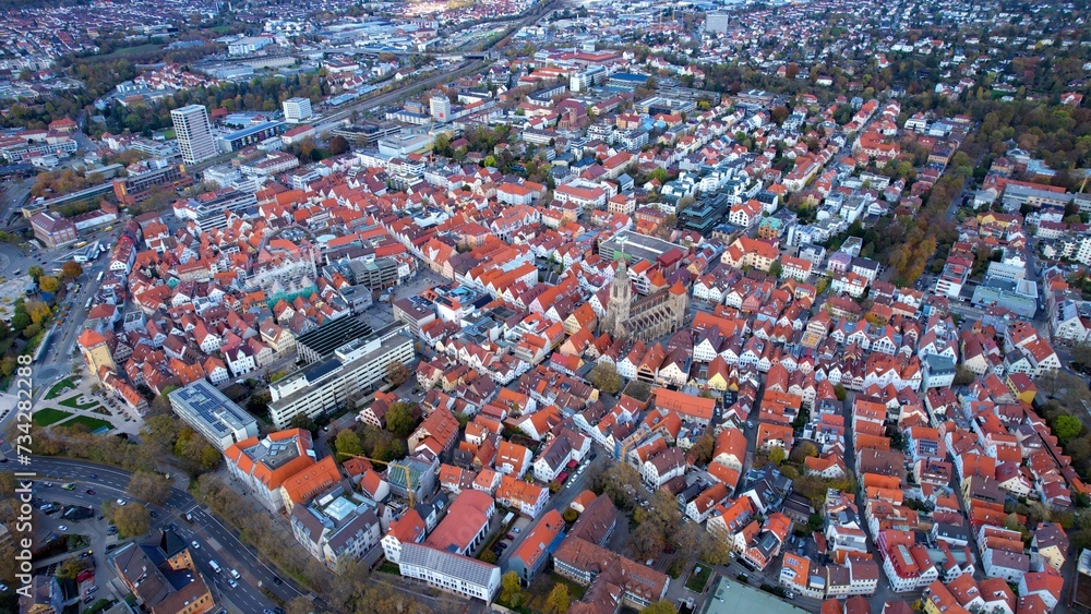 Aerial around the old town of the city Reutlingen in Germany on a afternoon in autumn.	