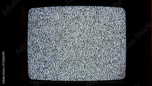 An old-fashioned television set emitting a screen full of black and white static noise, no signal, live interruption, simple abstract spooky scary horror background nobody, no people, end of broadcast