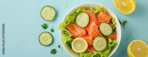 A fresh and appetizing salad featuring cucumbers and salted salmon, beautifully presented on a vibrant blue background.