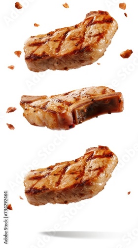 Two pieces of pork chops are placed on a white surface, creating a simple and clean composition.