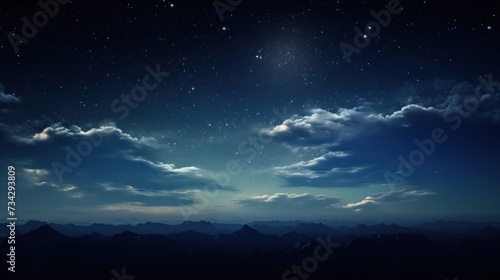 a night sky with clouds and stars above a mountain range with mountains in the foreground and a bright star in the middle of the sky.