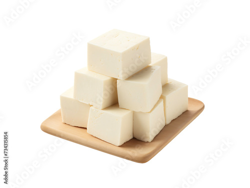 a pile of white cubes on a wooden plate