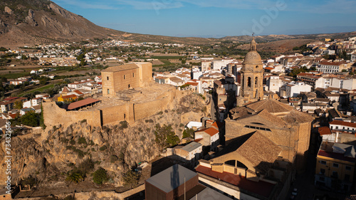 Aerial photo from drone to city of Loja and Church of the Incarnation with Moorish Alcazaba and Gorda Peak .Loja ,Granada, Andalusia, Spain, Europe (Series)