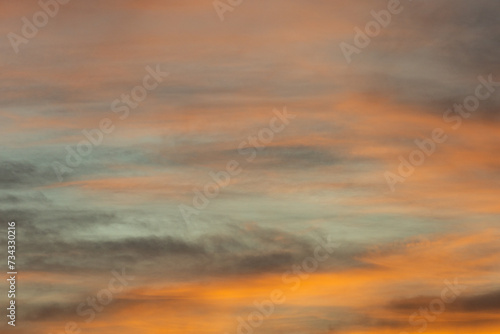 Golden, orange and blue clouds at sunset © VICTOR