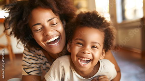 A photo of a mother and child laughing and playing together, with love and joy in the air.