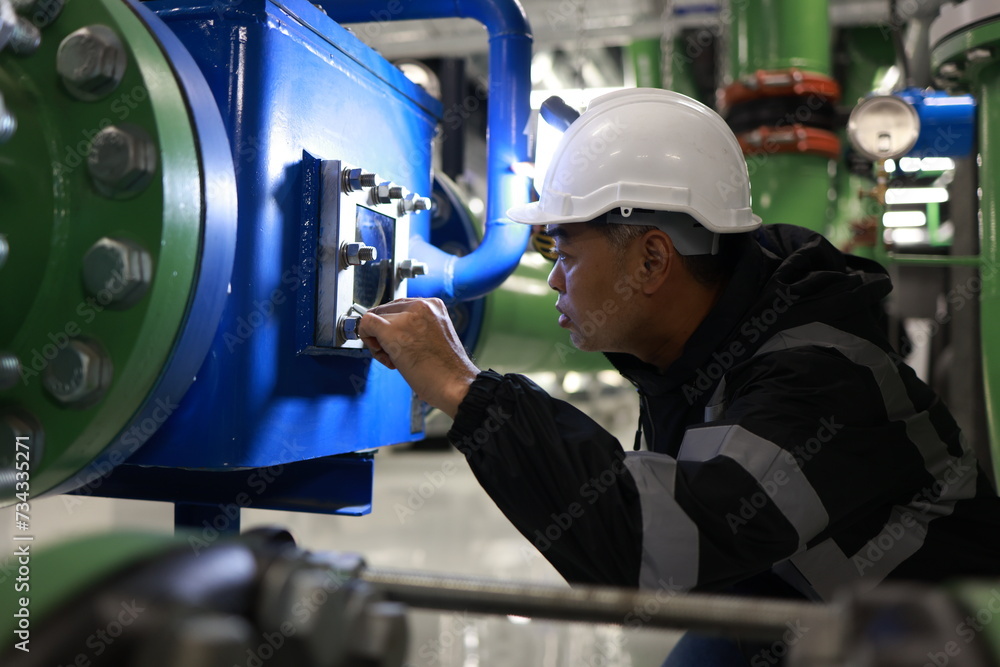A senior engineer is testing the energy flow to inspect the quality of equipment on the piping system. A senior engineer is testing the energy flow to inspect the quality of equipment on the piping system.