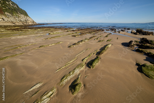 Paisaje de playa y mar con plataforma de abrasión en la costa cantábrica. photo