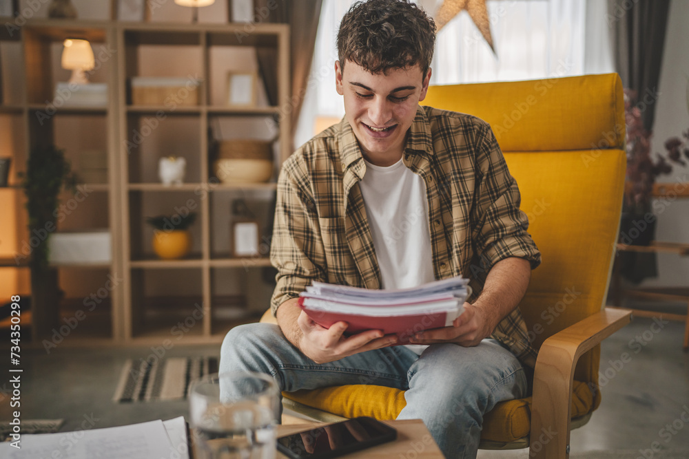 young caucasian man student study at home learn exam or prepare lesson