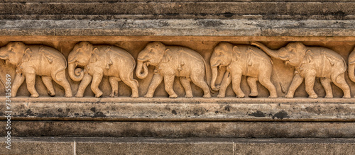 Ancient carvings of elephants around the walls of the Kelaniya Temple, Sri Lanka