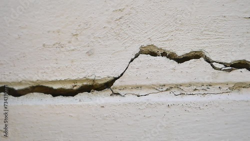 Old concrete wall texture large crack and dirty wall surface with large damage.