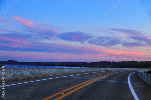 A beautiful sunset/sky over Norfork Lake from the 101 Bridge with the 62 Bridge in the background In Mountain Home, Arkansas 
