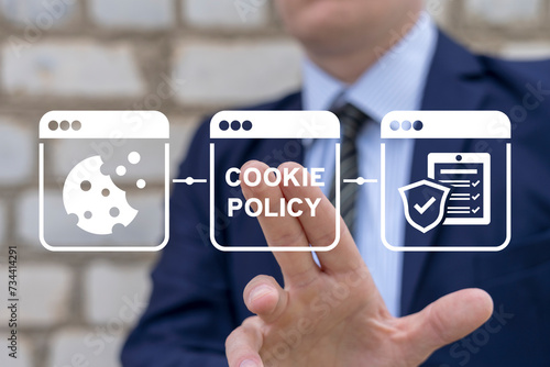 Businessman using virtual touchscreen presses inscription: COOKIE POLICY. Cookies Policy Web Concept. Internet web pop up for cookie policy notification. Allow all, refuse or choice. photo