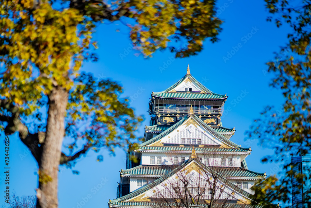 Landscape view Osaka's landmark Osaka Castle castle tower that shines in the blue sky, Osaka Japan. Landscape view Osaka's landmark Osaka Castle castle tower that shines in the blue sky, Osaka Japan.