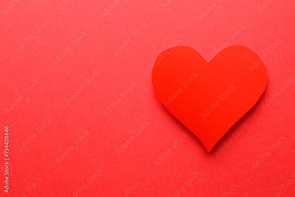 One paper heart on red background, top view. Space for text