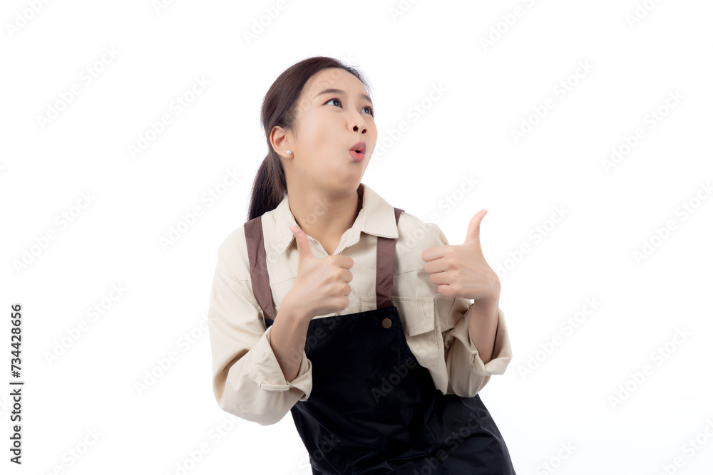 Portrait smiling young asian woman wearing apron showing thumbs up with hand isolated white background, young asian woman making thumbs up gesture, waitress or entrepreneur, small business or startup. Portrait smiling young asian woman wearing apron showing thumbs up with hand isolated white background, young asian woman making thumbs up gesture, waitress or entrepreneur, small business or startup.