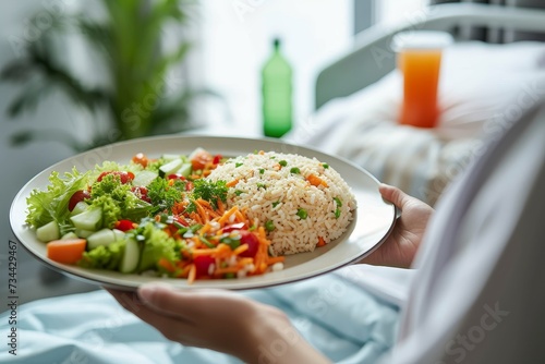 A person enjoys a delicious meal, savoring the vibrant colors and fresh flavors of a vegetable salad on their plate, surrounded by elegant tableware and the warm ambiance of an indoor dining experien photo