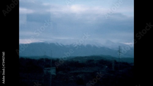 Snow Covered Peaks Near Golan 1975 - Snow covered peaks are seen in the backgorund from a car as it travels in the Golan Heights in 1975.  photo