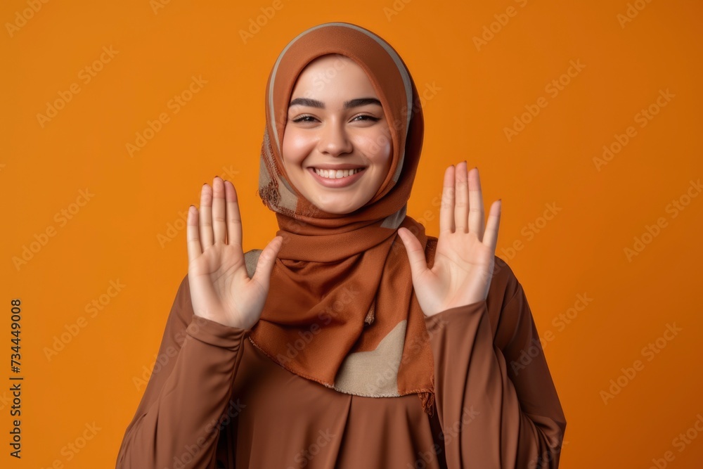 Potrait of a hijab woman smiling with isolated background Potrait of a hijab woman smiling with isolated background