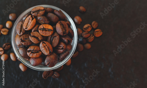 Brown Roasted Coffee Beans Closeup in a cup On Wooden Dark Background with Empty Copy Space for Text