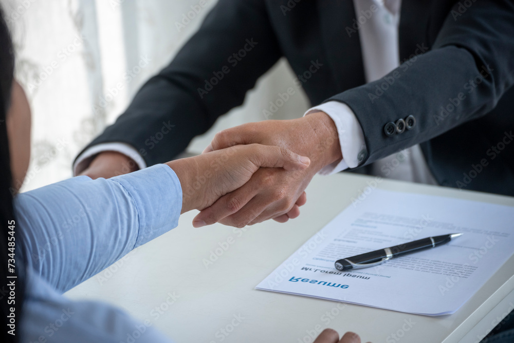 Close up hands Team Business Partners shaking hands together to Greeting Start up new project. Shakehand Teamwork Partnership office desk. Businessman partners handshake together. Business concept Close up hands Team Business Partners shaking hands together to Greeting Start up new project. Shakehand Teamwork Partnership office desk. Businessman partners handshake together. Business concept