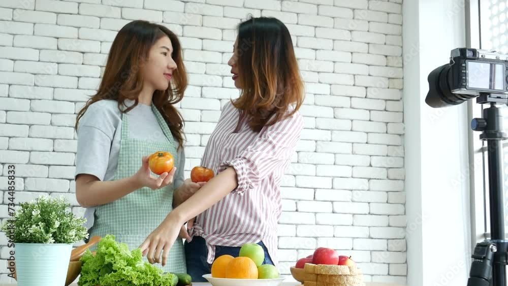 Asian influencer vlogger live review tomato skin care healthy eating lifestyle. Two Young Women Friends blogger vlog Happy Lifestyle vitamin C tomato vegetable fruit. Vlog Two women talk social media Asian influencer vlogger live review tomato skin care healthy eating lifestyle. Two Young Women Friends blogger vlog Happy Lifestyle vitamin C tomato vegetable fruit. Vlog Two women talk social media