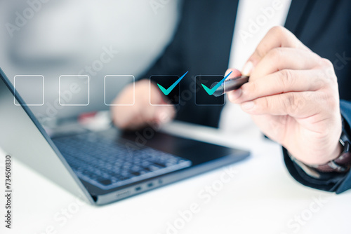 Document checklist online organizational leadership for business in organization performance. Checklist concept, Businessman checking mark on the check boxes