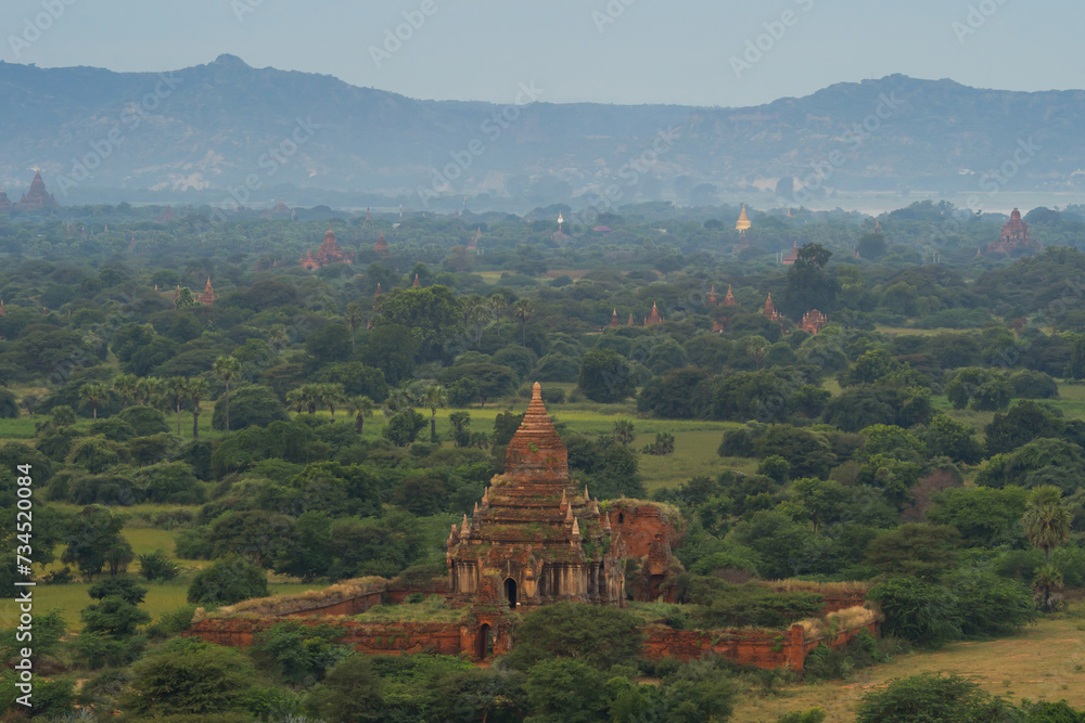 Aerial top view of burmese temples of Bagan City from a balloon, unesco world heritage with forest trees, Myanmar or Burma. Tourist destination.