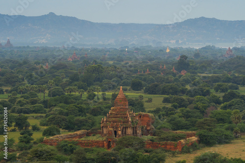 Aerial top view of burmese temples of Bagan City from a balloon  unesco world heritage with forest trees  Myanmar or Burma. Tourist destination.