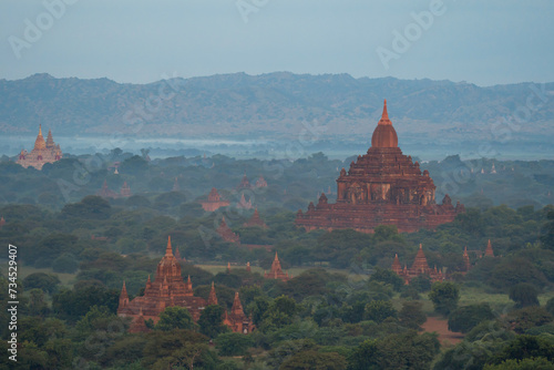Aerial top view of burmese temples of Bagan City from a balloon  unesco world heritage with forest trees  Myanmar or Burma. Tourist destination.