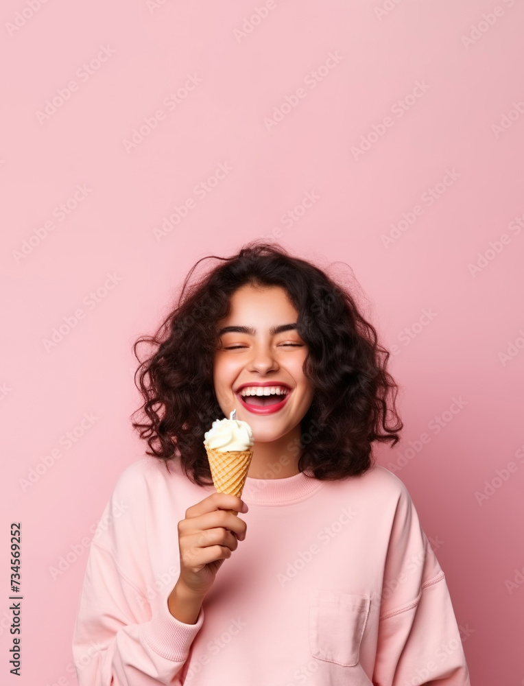 Summer portrait of happy young woman eating ice cream wearing sunglasses on pink background. Summer portrait of happy young woman eating ice cream wearing sunglasses on pink background.